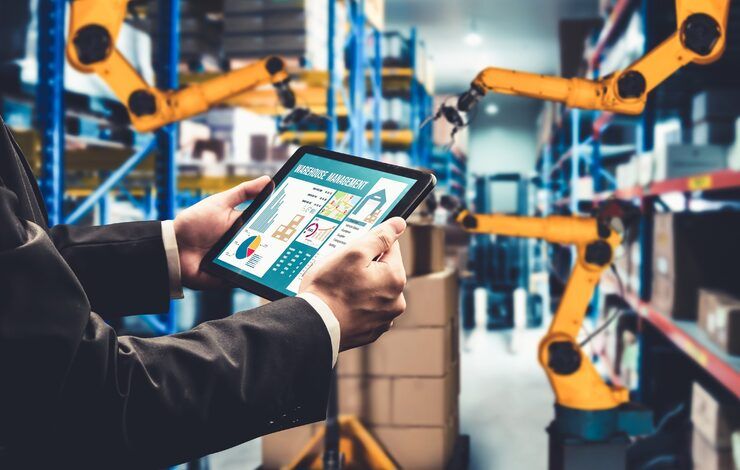 A robotic arm moving stock in an automated warehouse
